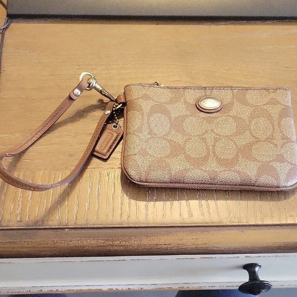 Coach Handbags - Coach Brown vinyl leather trim & Strap Signature Pattern Wristlet with hangtag